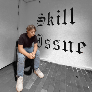 grabb som sitter på en stol i ett hörn med text på väggen